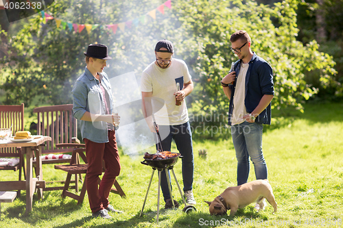 Image of friends drinking beer at summer barbecue party