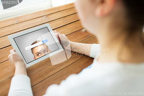 Image of close up of woman with search bar on tablet pc