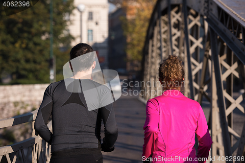 Image of young  couple jogging