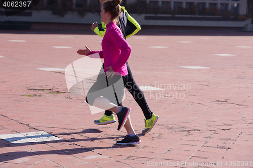 Image of young  couple jogging