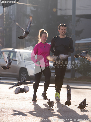 Image of young  couple jogging