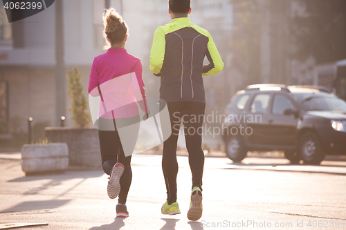 Image of young  couple jogging