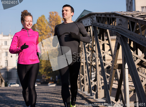 Image of young  couple jogging