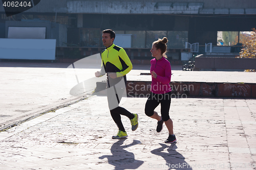 Image of young  couple jogging