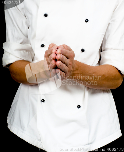 Image of Professional chef with a hand gesture towards, wearing a chefs j