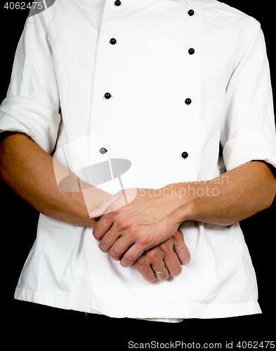 Image of Professional chef with a hand gesture towards, wearing a chefs j