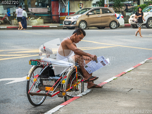 Image of Tricycle driver in Yangon, Myanmar