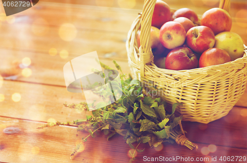 Image of close up of melissa and basket with apples