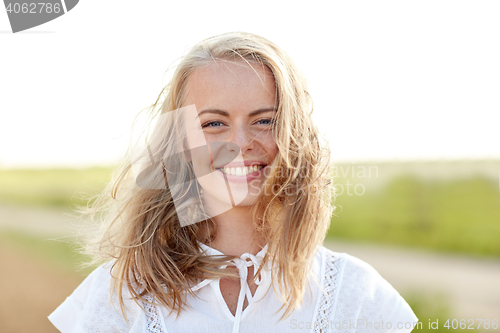 Image of close up of happy young woman in white outdoors