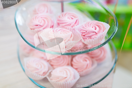 Image of close up of custard sweets on glass serving tray