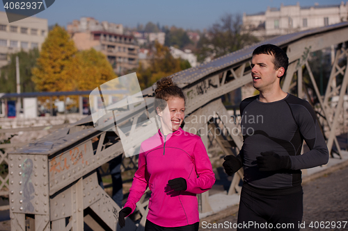 Image of young  couple jogging