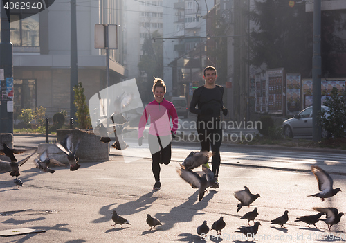 Image of young  couple jogging