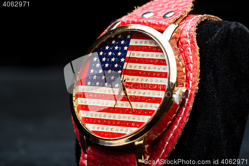 Image of clock on a black background. American Flag