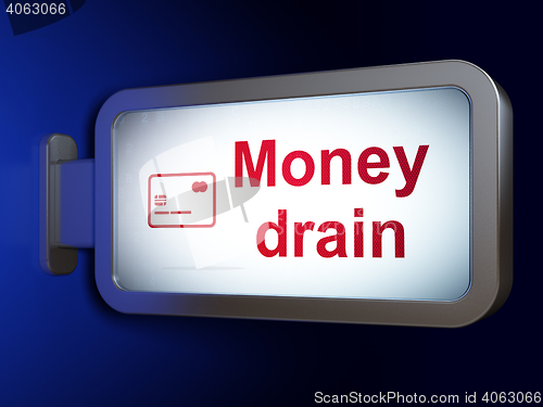 Image of Money concept: Money Drain and Credit Card on billboard background