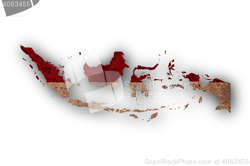 Image of Map and flag of Indonesia on rusty metal