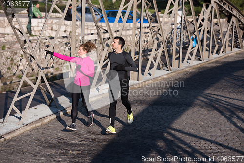 Image of young  couple jogging