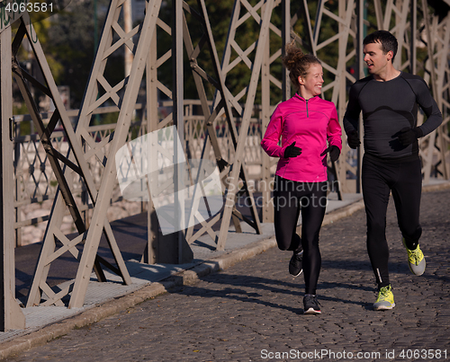 Image of young  couple jogging