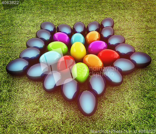 Image of Colored Easter eggs as a flower on a green grass. 3D illustratio