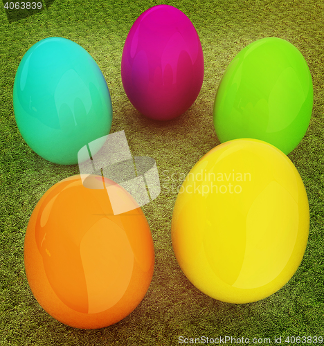 Image of Colored Easter eggs on a green grass. 3D illustration. Vintage s