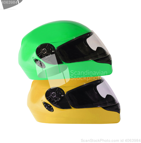 Image of Orange and green bike helmets