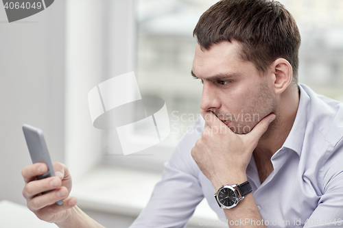 Image of close up of businessman with smartphone