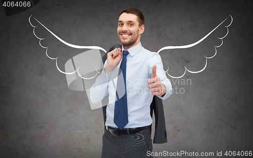 Image of businessman with angel wings showing thumbs up