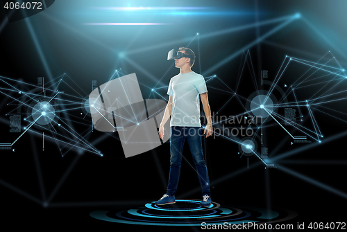 Image of happy man in virtual reality headset or 3d glasses