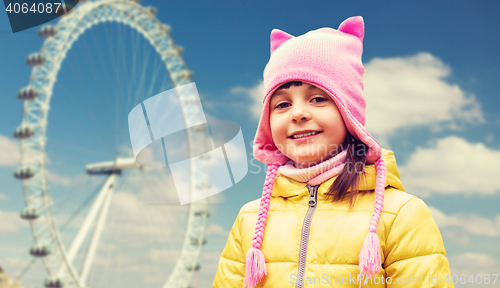 Image of happy little girl over london ferry wheel