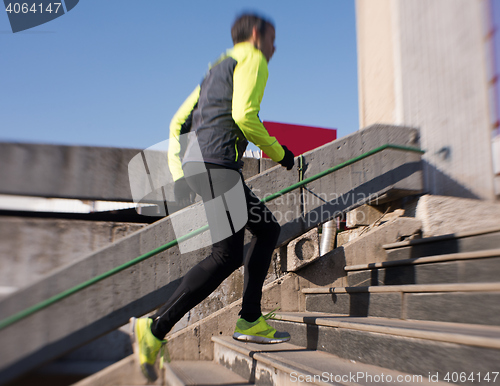 Image of man jogging on steps