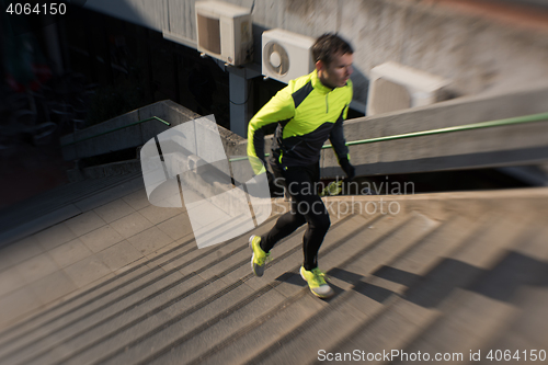 Image of man jogging on steps