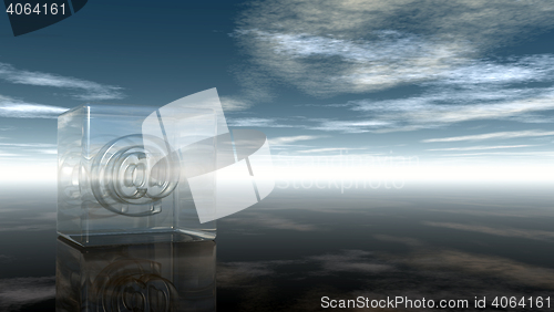 Image of email symbol in glass cube under cloudy sky - 3d rendering
