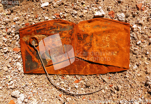 Image of Old crushed rusty bucket