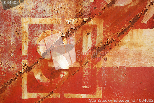 Image of old rusty painted metal wall with numbers