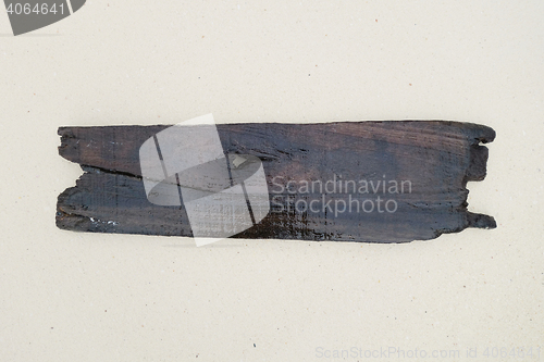 Image of old wood board on a beach