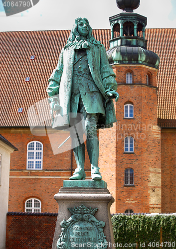 Image of The statue of Chancellor Peder Griffenfeld and a tower in Copenh