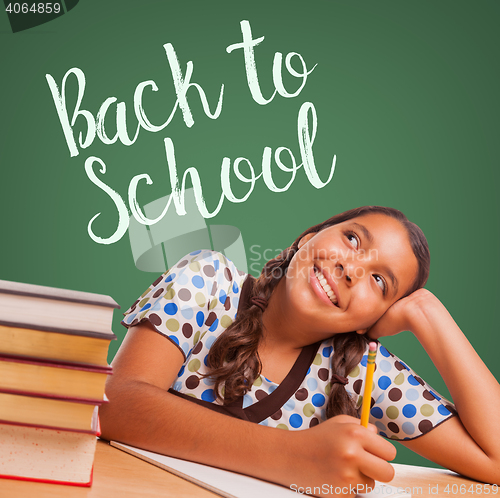 Image of Cute Hispanic Girl Studying and Looking Up to Back To School Wri