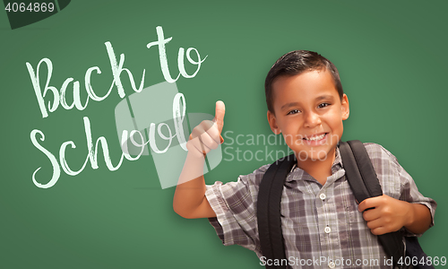 Image of Thumbs Up Hispanic Boy in Front of Back To School Chalk Board