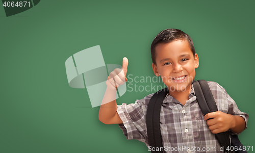 Image of Cute Hispanic Boy In Front of Blank Chalk Board