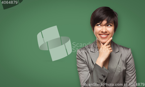 Image of Attractive Young Woman Looking Up to Blank Chalk Board