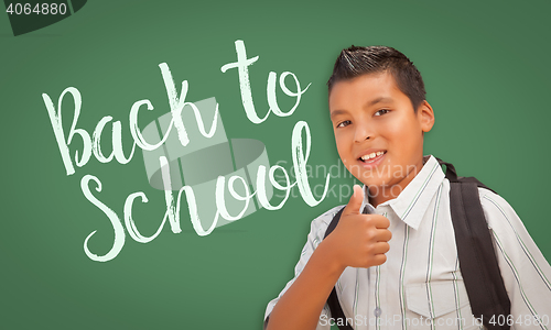 Image of Thumbs Up Hispanic Boy in Front of Back To School Chalk Board
