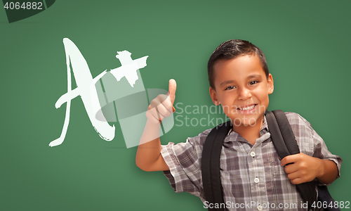 Image of Hispanic Boy with Thumbs Up in Front of A+ Written on Chalk Boar