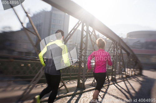 Image of young  couple jogging