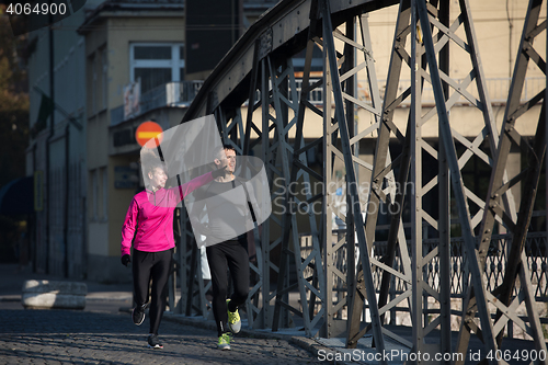 Image of young  couple jogging