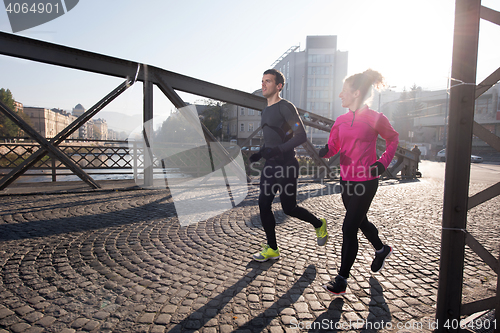 Image of young  couple jogging