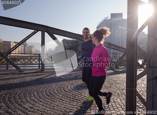 Image of young  couple jogging