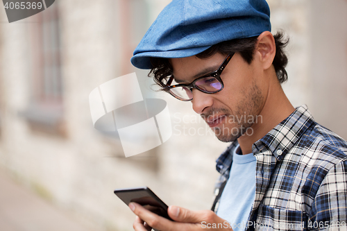 Image of close up of man texting message on smartphone