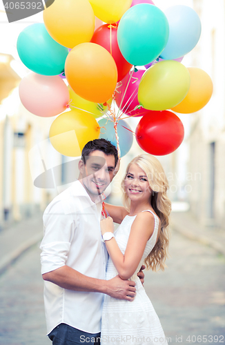 Image of couple with colorful balloons