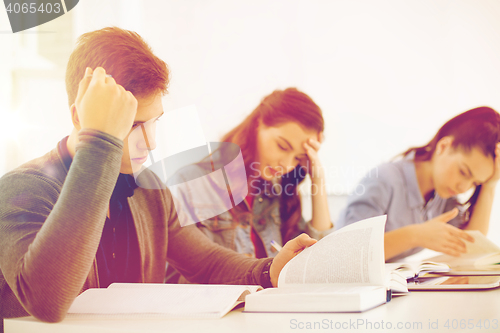 Image of students with notebooks and tablet pc at school