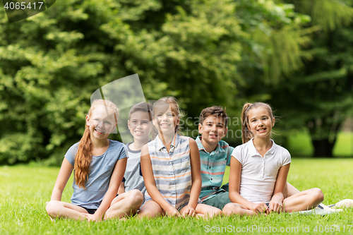 Image of group of happy kids or friends outdoors