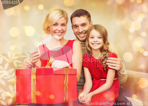 Image of happy family opening gift box